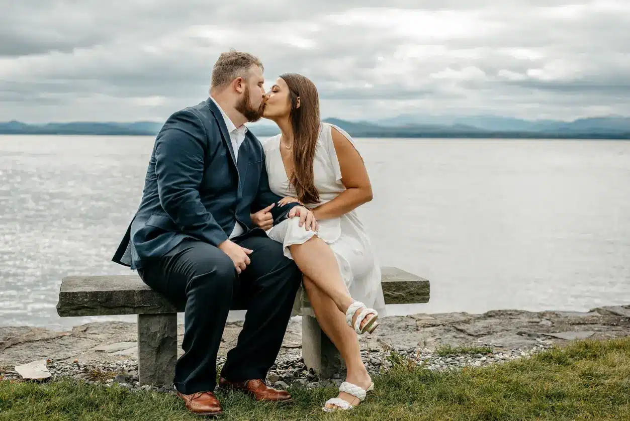 couple kissing by the lake