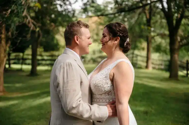 Groom holding bride's waist