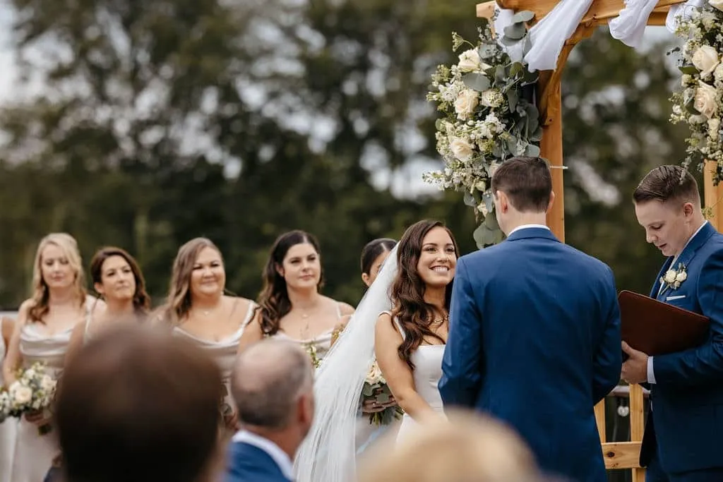 Bride looking at her groom during the wedding ceremony | Love in Focus Studio