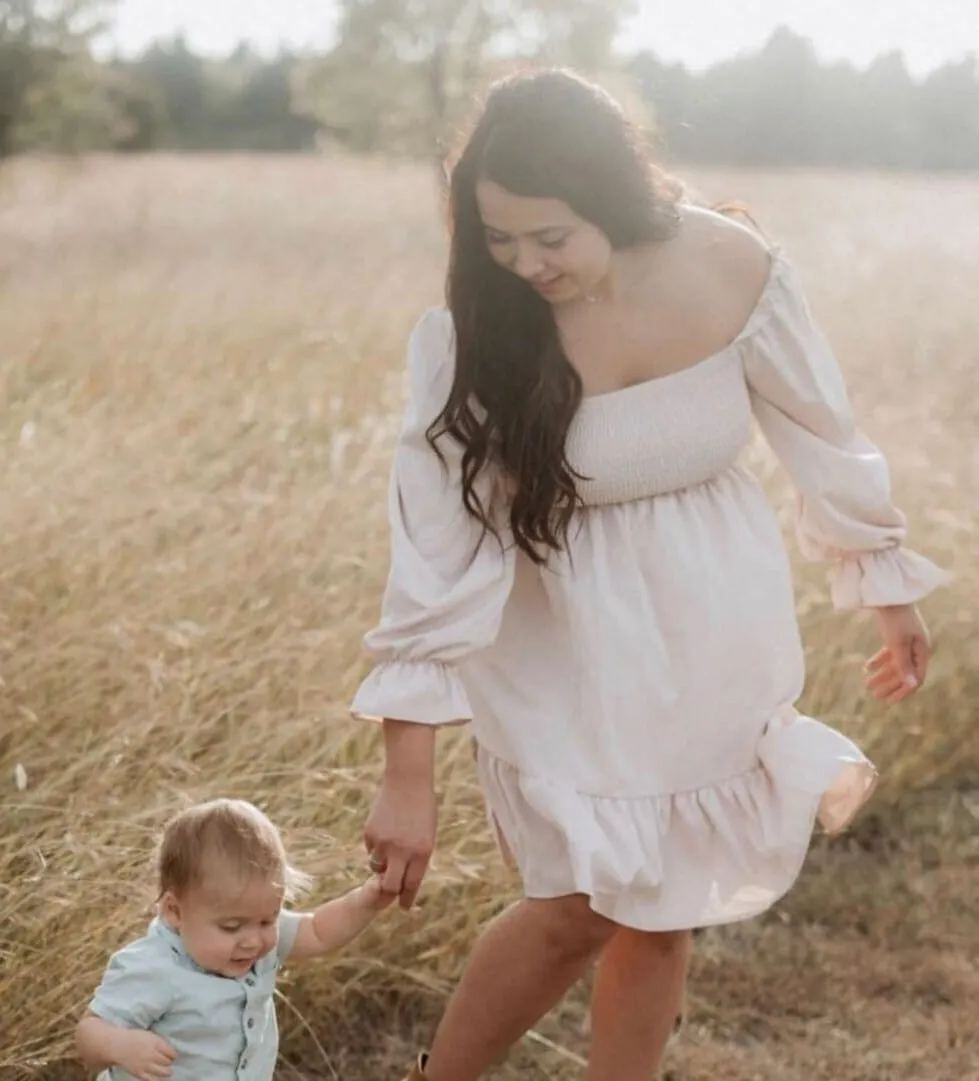 Bride holding the baby in her arms