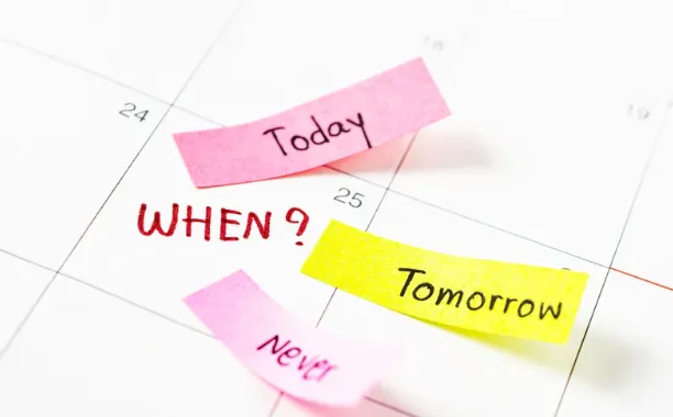 Calendar with sticky notes used to plan a wedding date