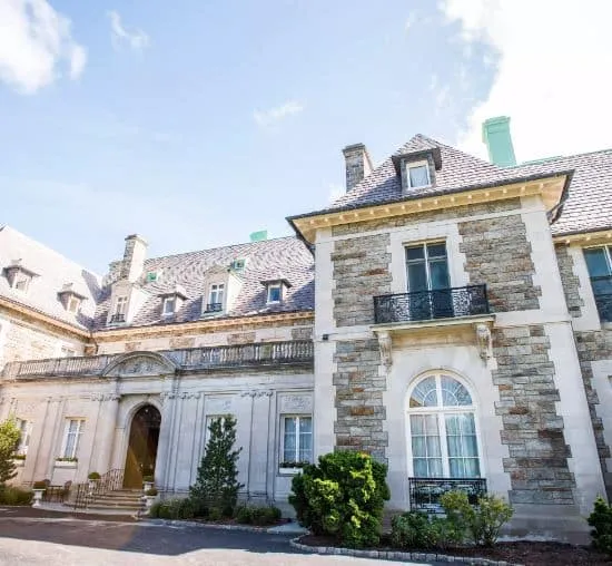 stone facade of the Aldrich Mansion in Warwick, Rhode Island on a bright, sunny day
