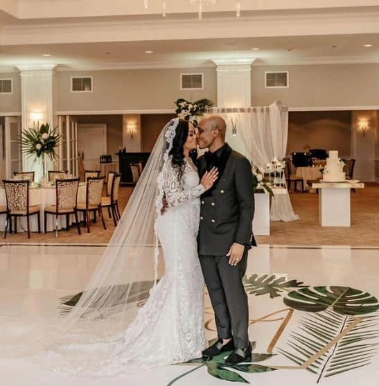 A bride and groom kiss on the dance floor at Rolling Hills Country Club in Wilton, Connecticut.