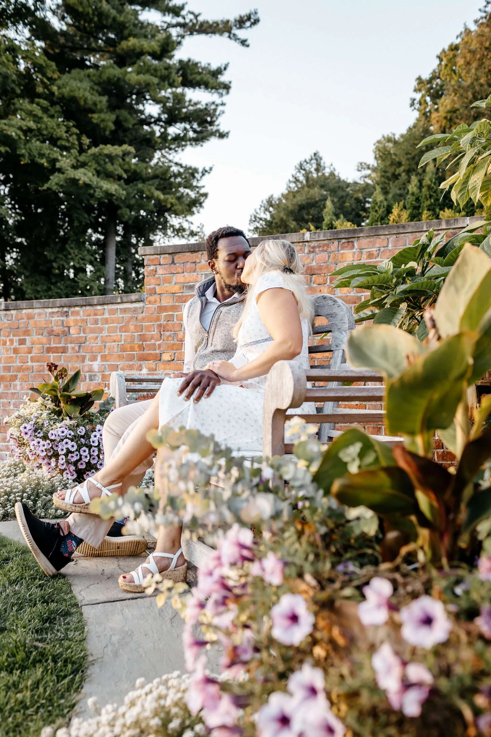 Couple sitting on a garden bench.