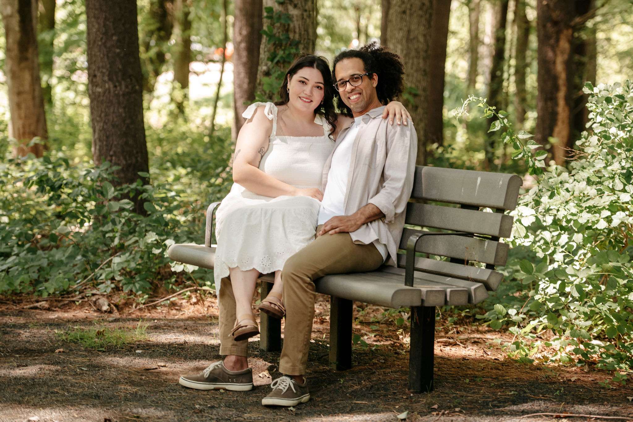 Couple sitting on a park bench.