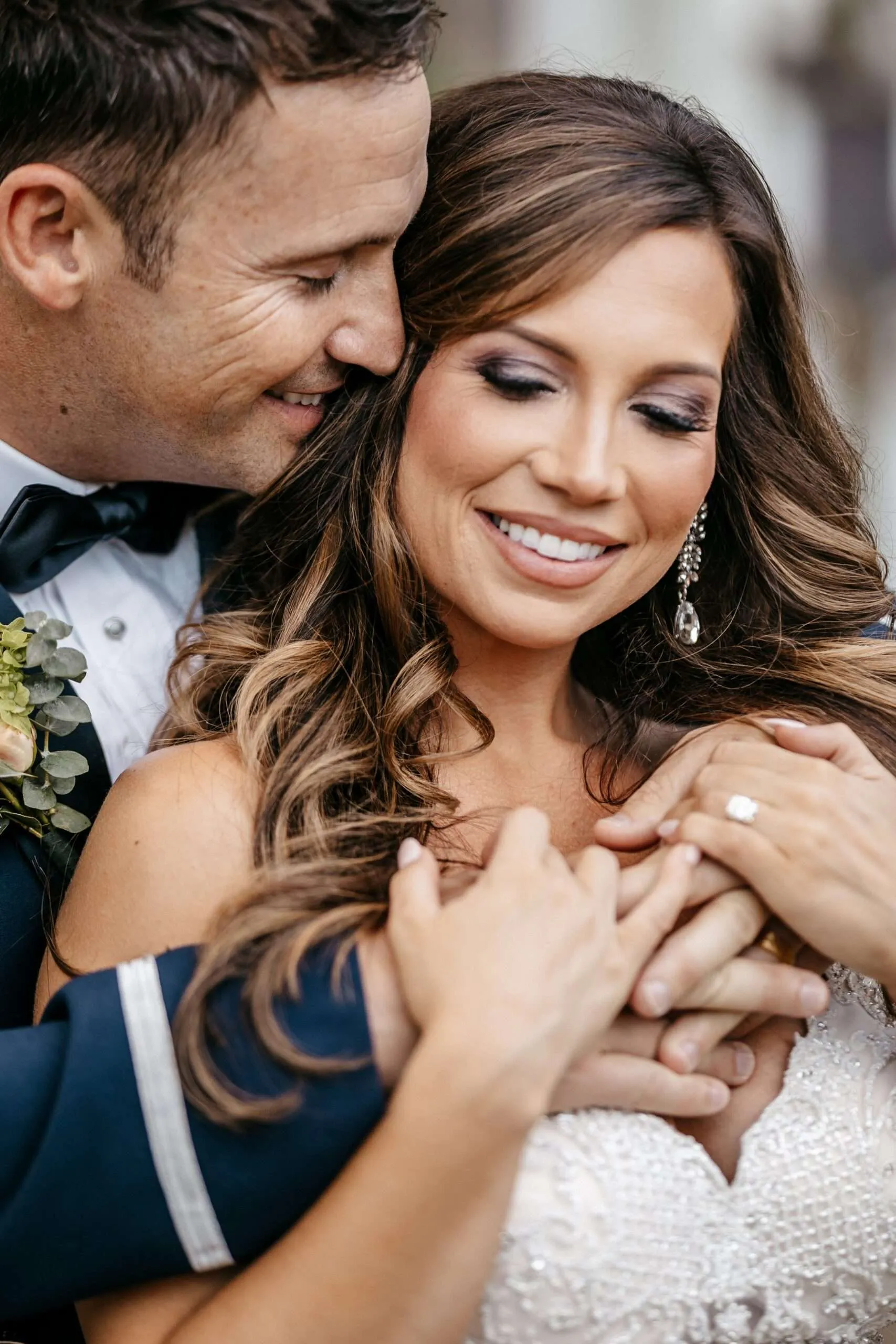 Kaliegh and Lacy posing for a romantic portrait during their outdoor military wedding celebration.