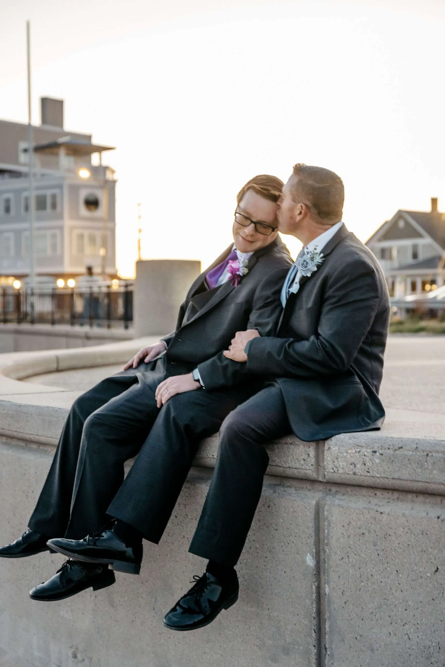 Larry and Josh posing during their gay wedding photography session at Hampton Beach, New Hampshire.
