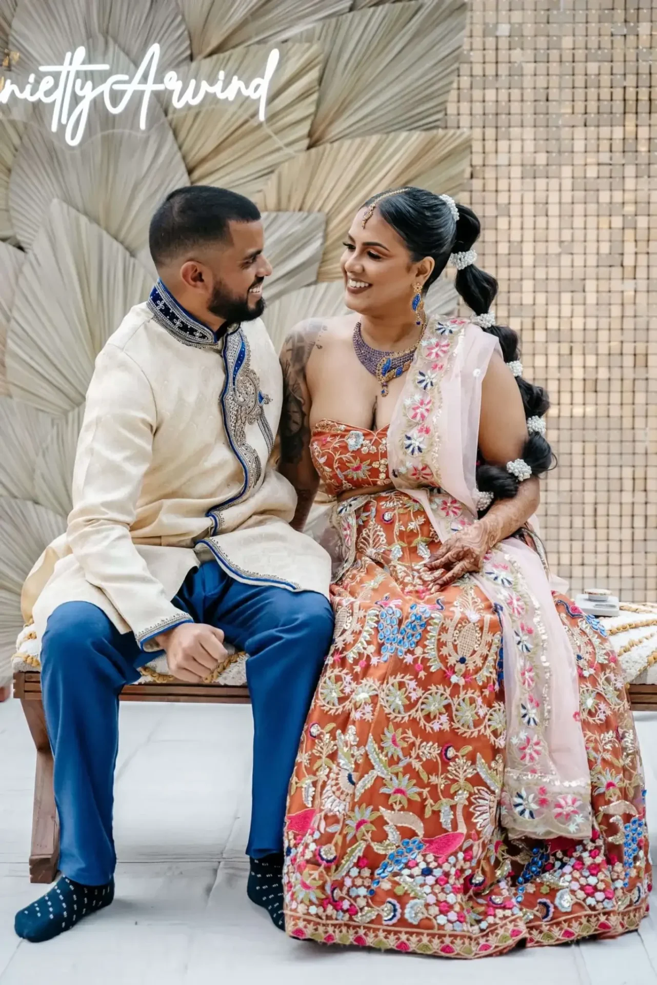 Hindu wedding photography of Arvind and Stephnie during the Mehendi ceremony, showcasing traditional attire.