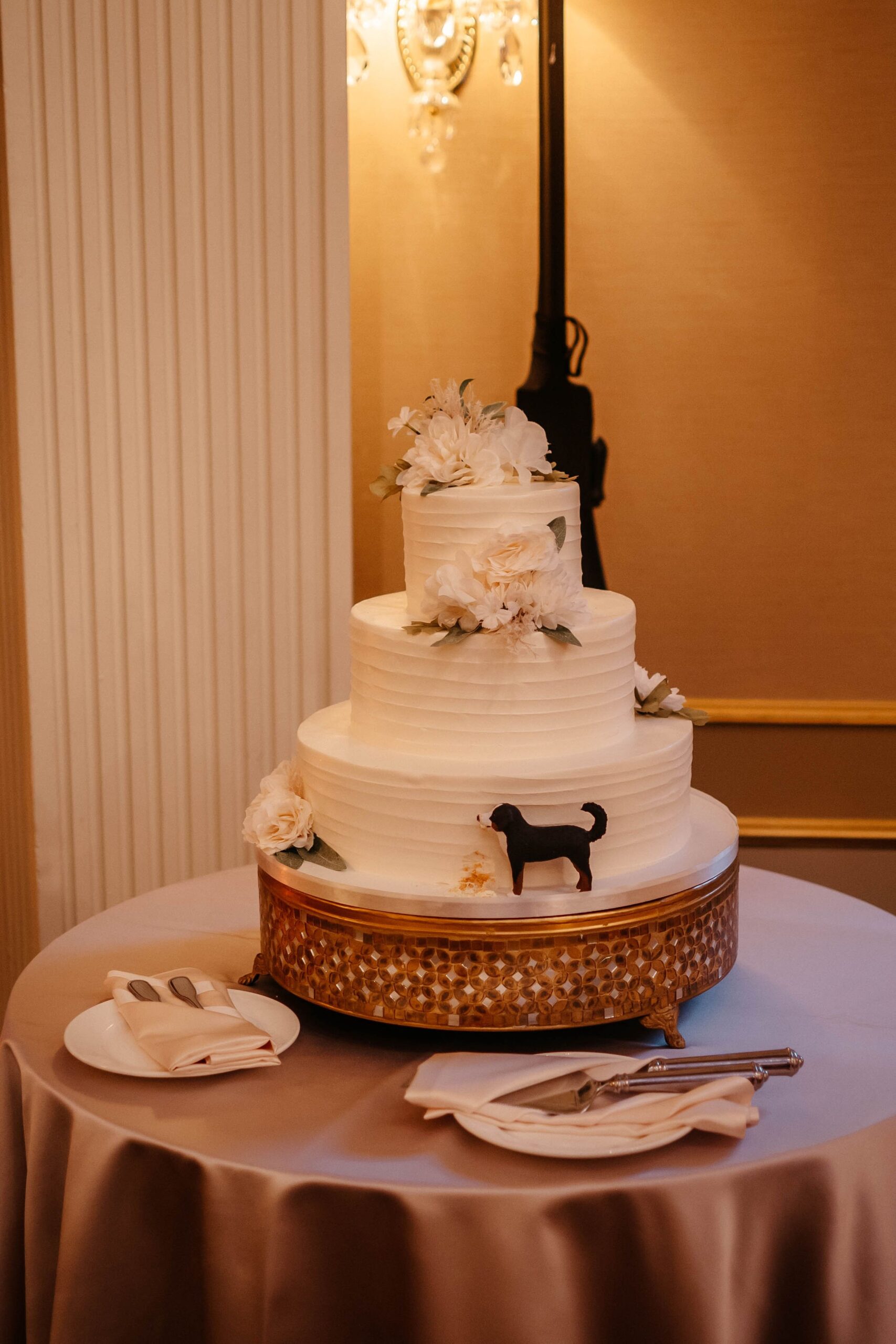 Three-tier white wedding cake with floral details at Boston hotel wedding venue reception