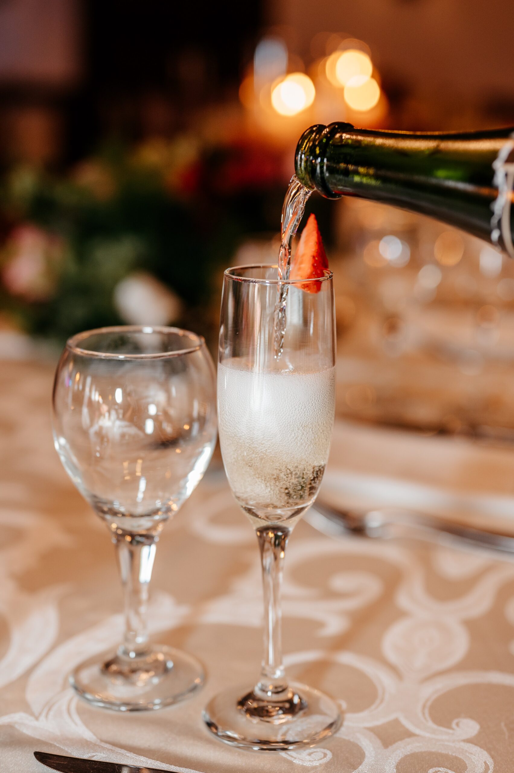 Champagne being poured for wedding toast at Cafe Escadrille in Burlington, elegant reception detail reflecting venue experience and wedding cost
