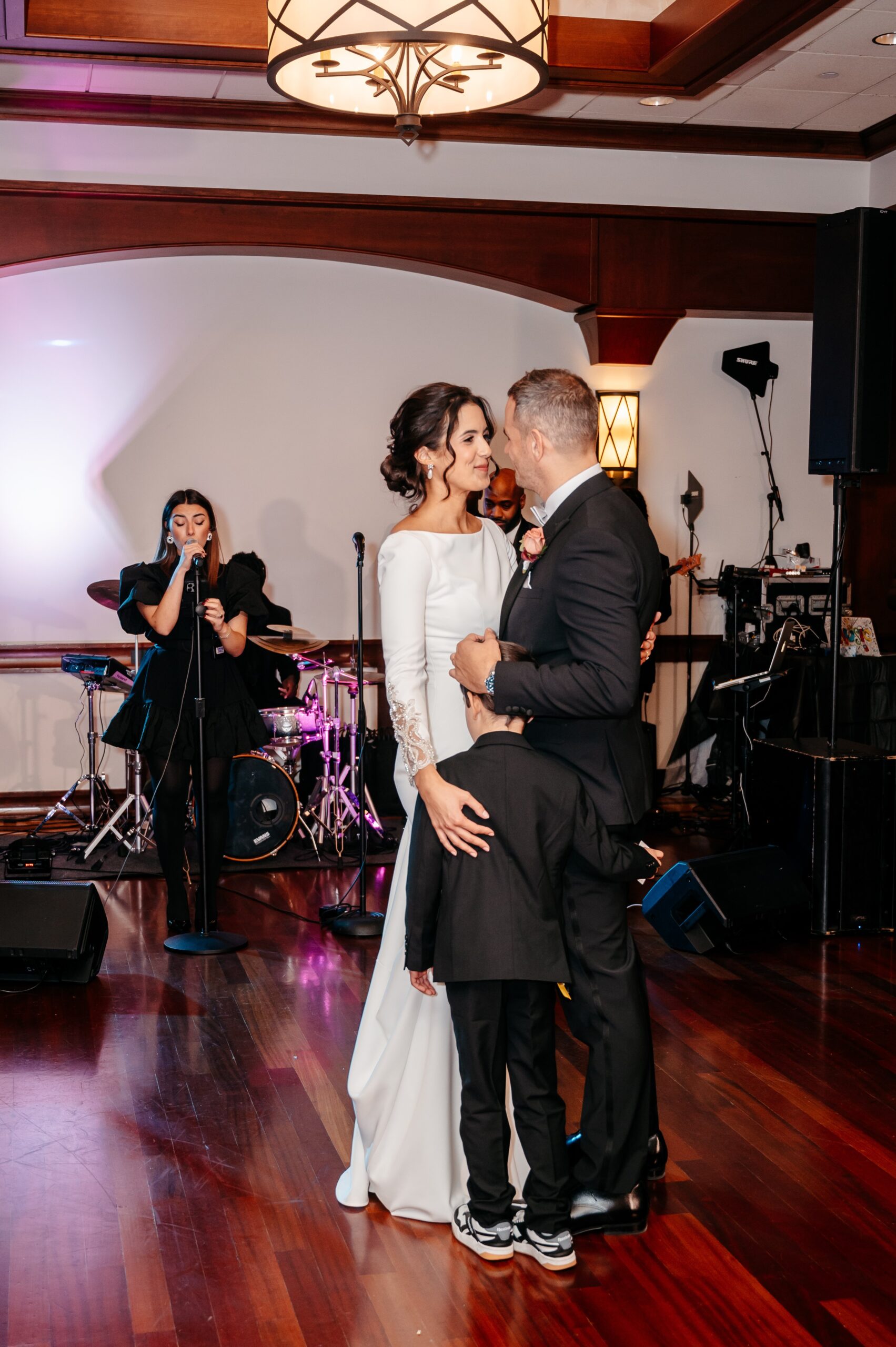 Bride and groom first dance with live band at Cafe Escadrille wedding in Burlington, romantic reception moment and premium wedding experience