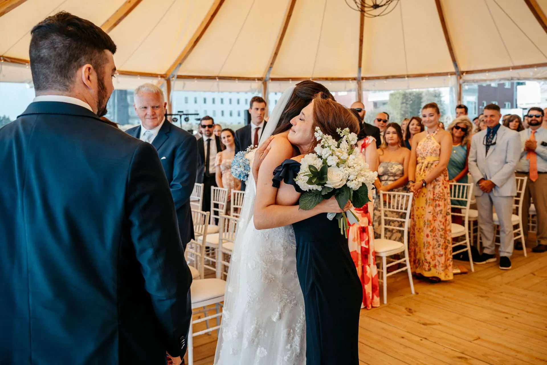 Mother and Bride embrace at the alter at Burlington wedding locations