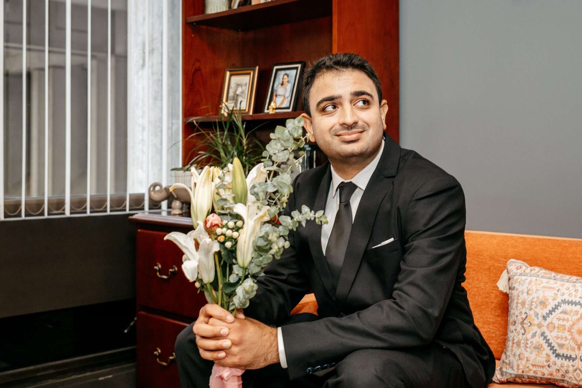 Groom smiles at his city hall wedding while getting married in massachusetts