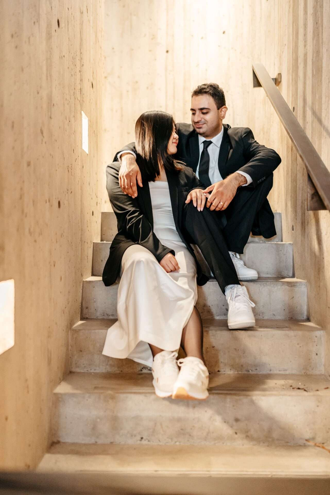 Bride and Groom look longingly at each other during city hall wedding while getting married in massachusetts