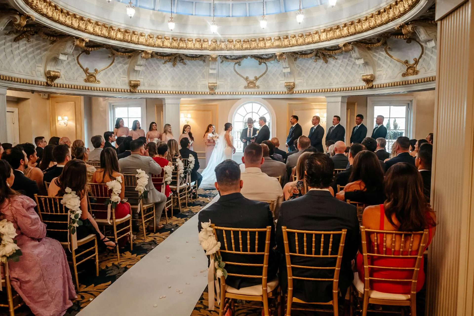 Bride and Groom stand at the alter showing How to Get Married in Massachusetts
