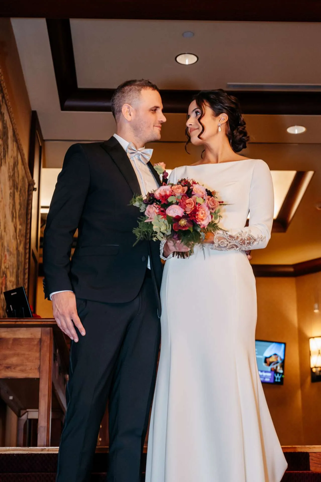 Bride and groom gaze at each other and smile while getting married in massachusetts