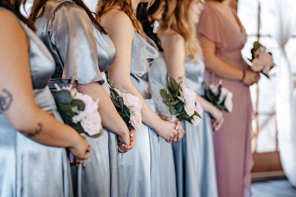 How much does a wedding cost in Boston with four bridesmaids in blue dresses