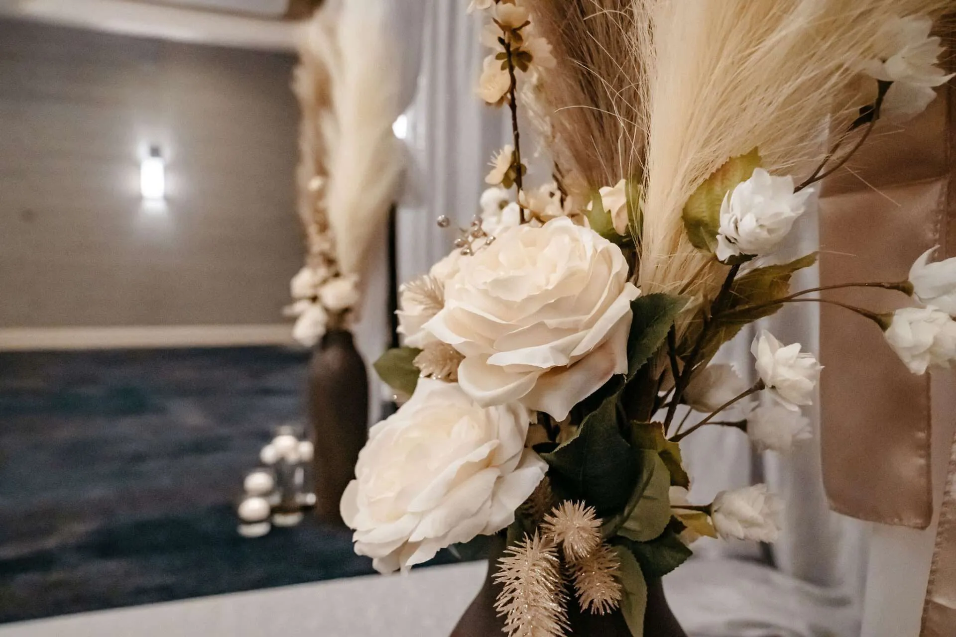 White flowers on display at wedding ceremony in Burlington wedding venues