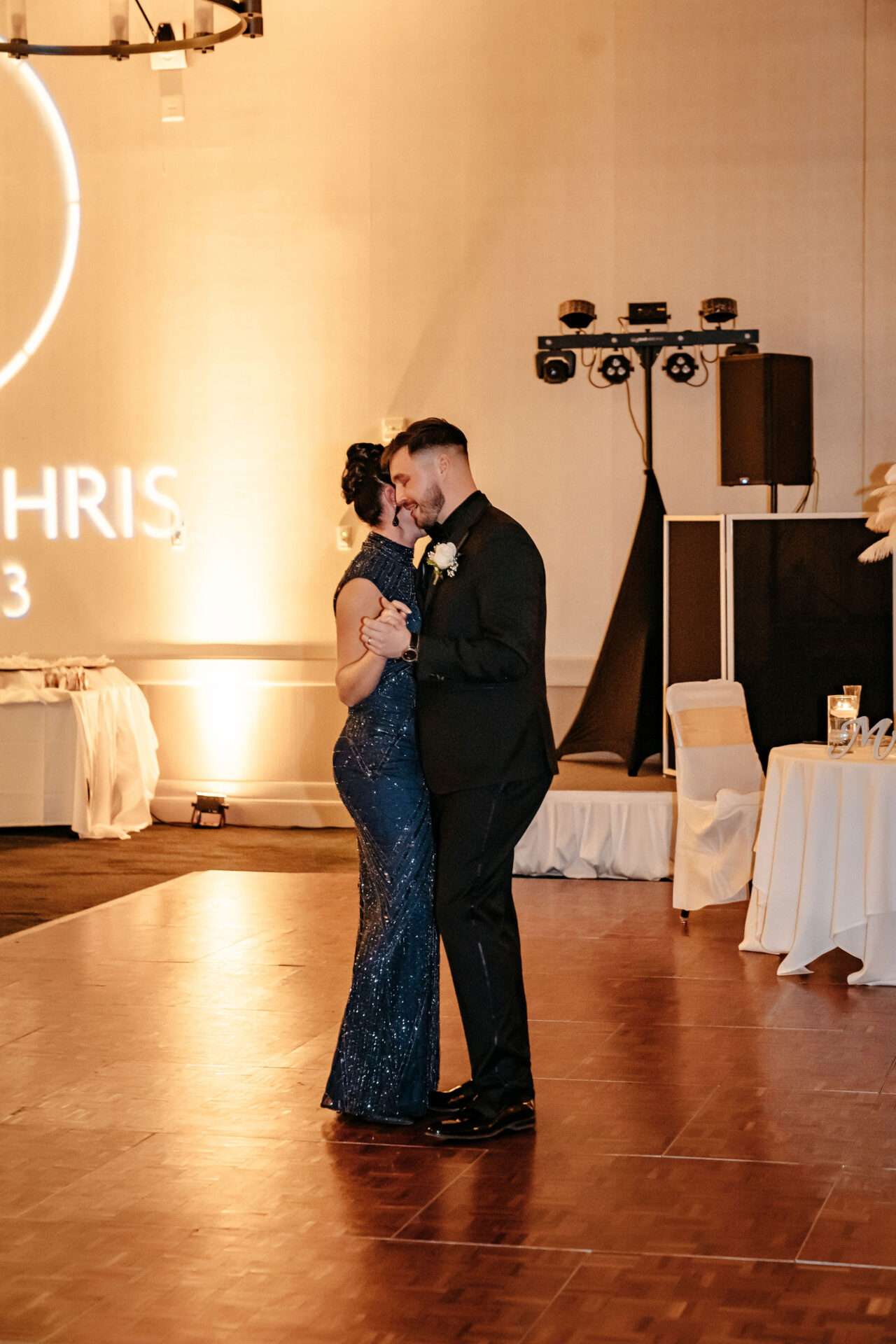 Mother of the Groom and Groom dance and wonder how much does a wedding cost in Boston?