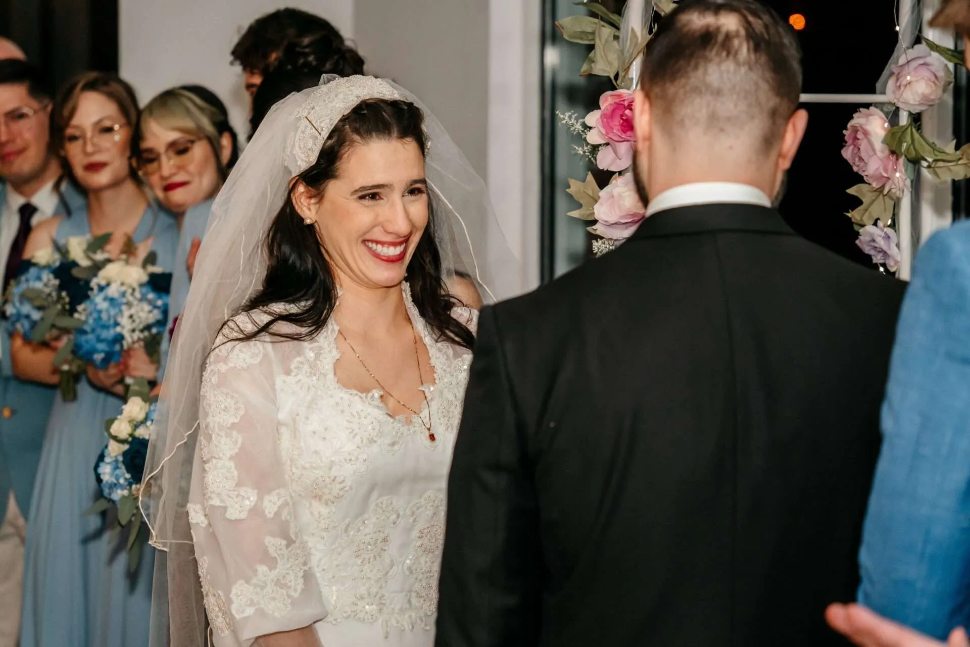 Bride and groom smile at each other at their Seaport Boston wedding venue