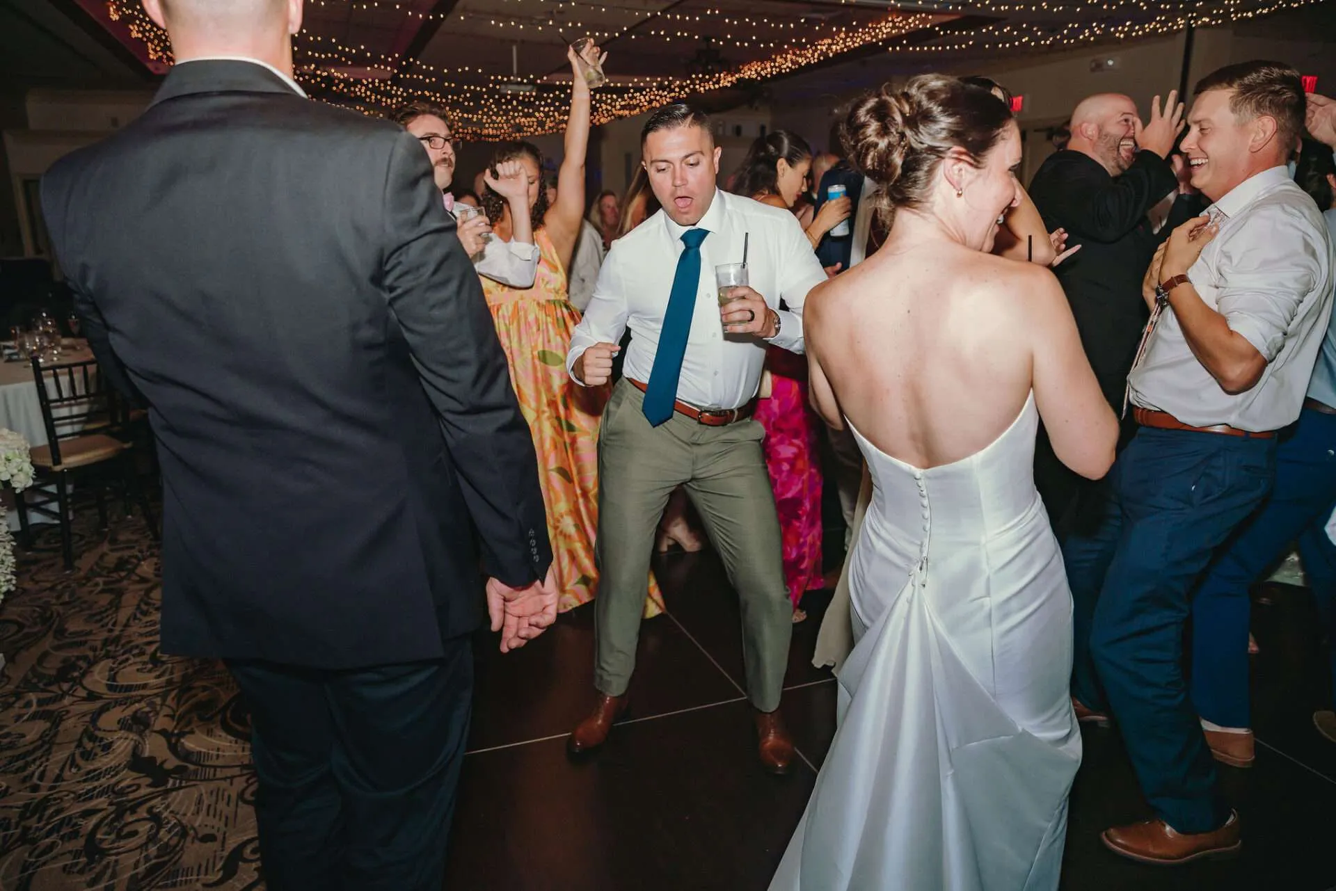 Guests dance during a reception at a Seaport wedding venue