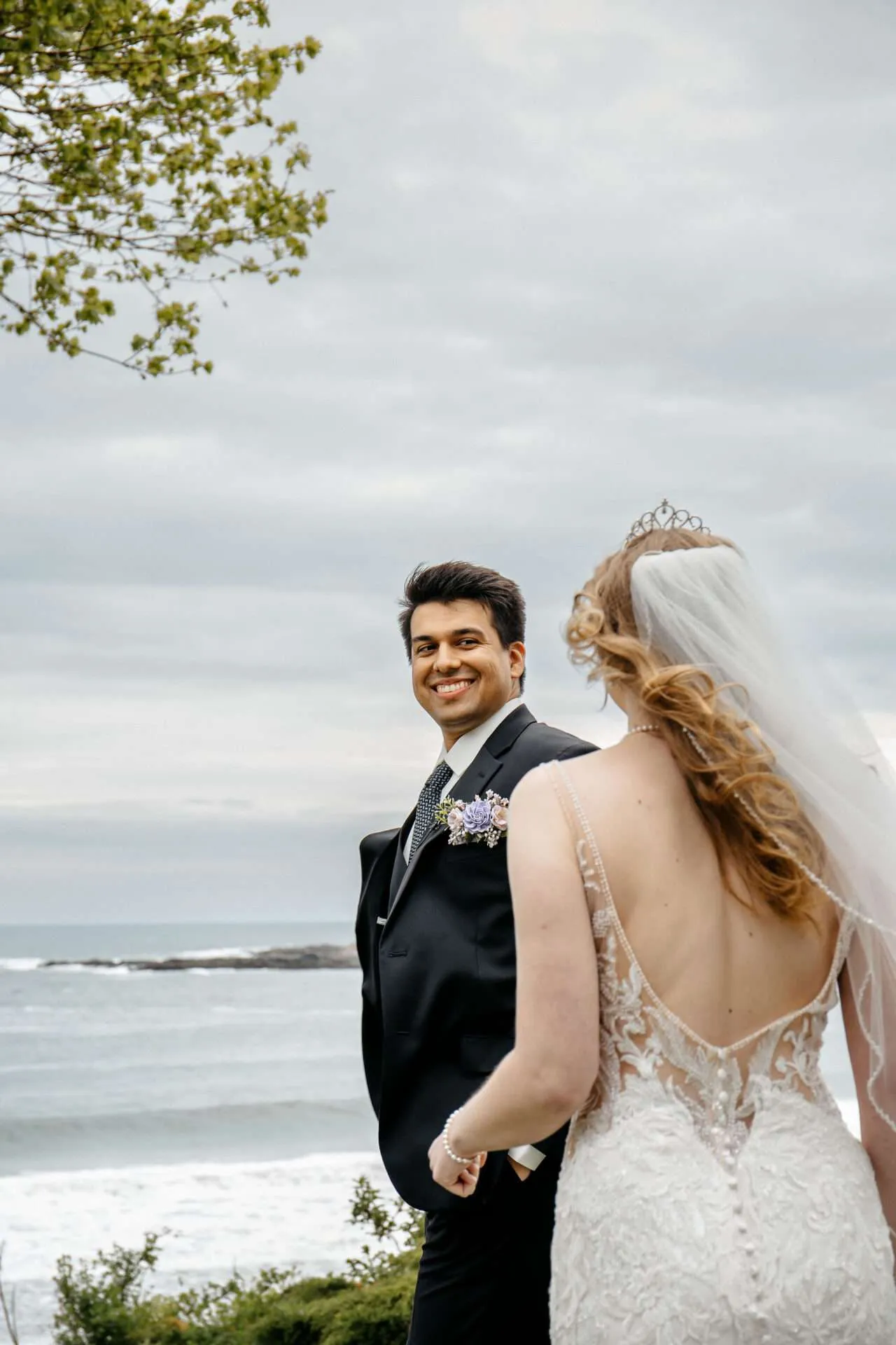 A bride and groom share their first look before the ceremony at their Boston Seaport wedding venue
