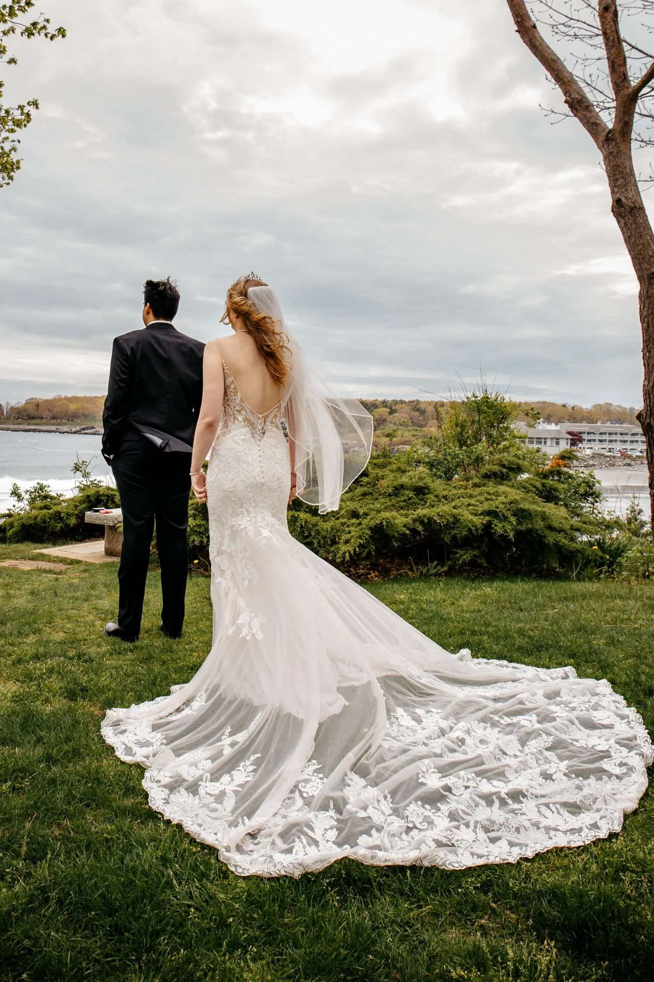 A bride and groom prepare to share their first look at their Boston Seaport wedding venue