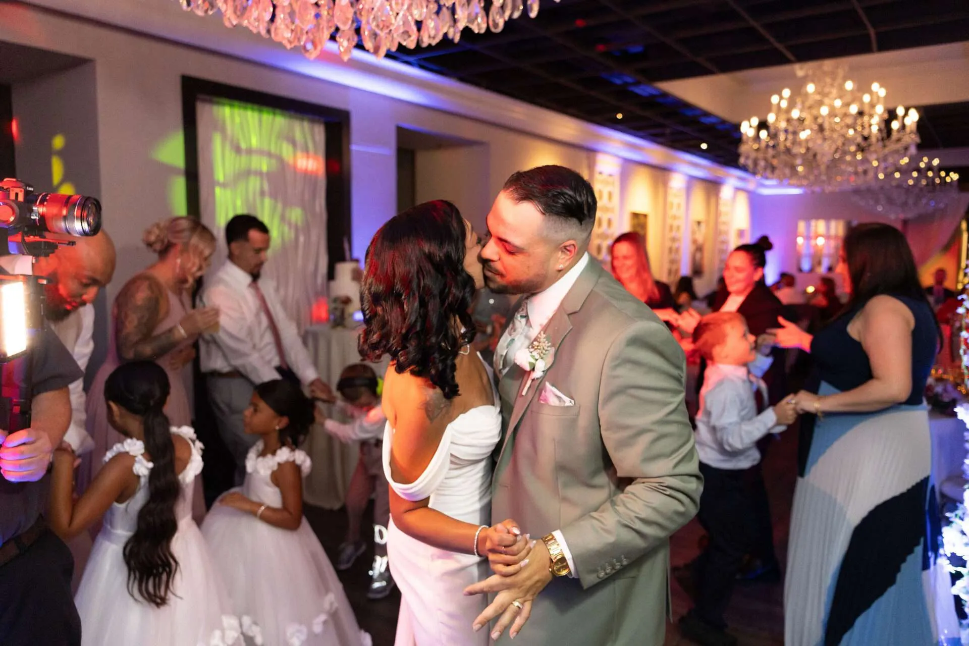 A bride and groom share a kiss on the dance floor at their Seaport wedding venue