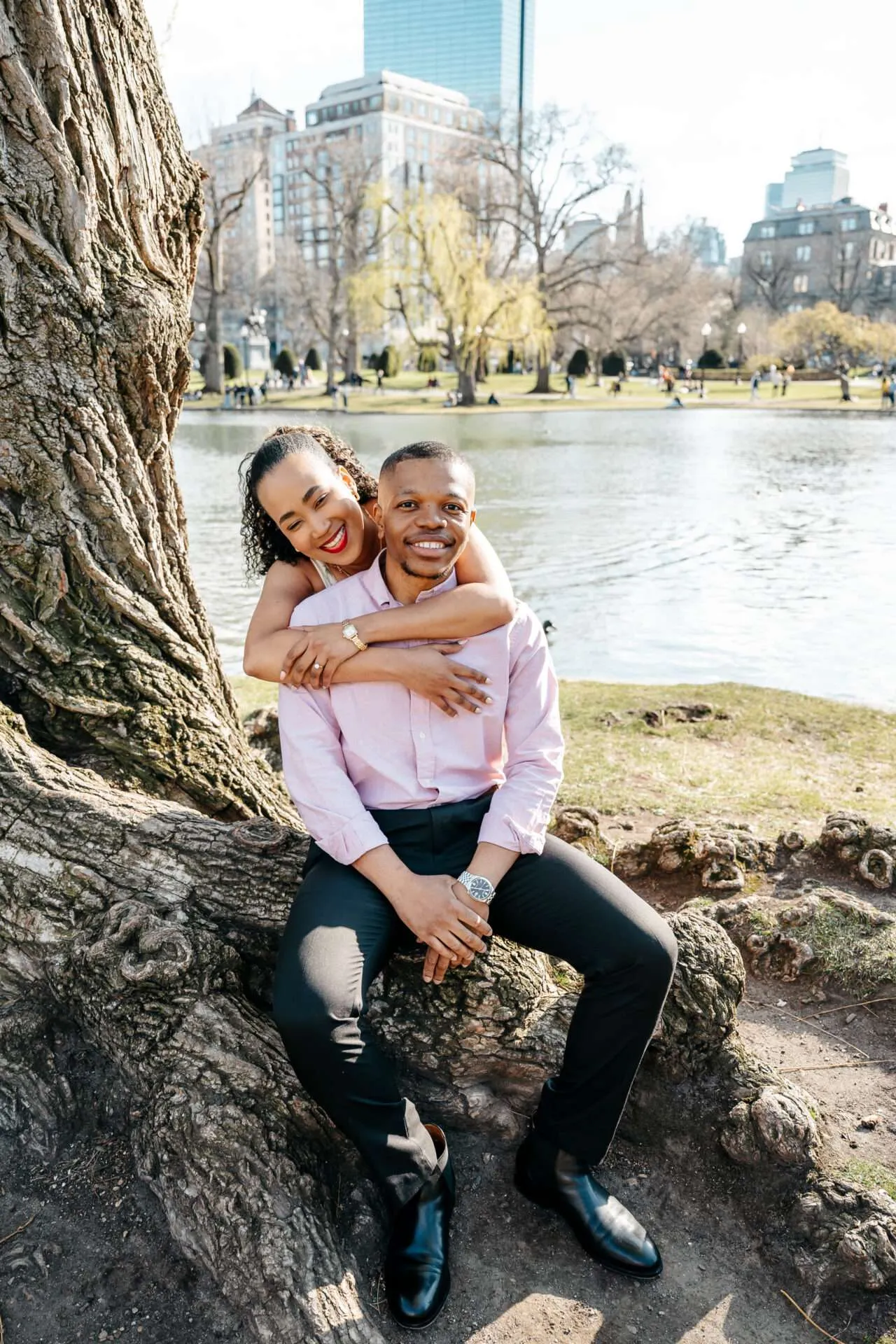 couple taking pictures at boston public garden