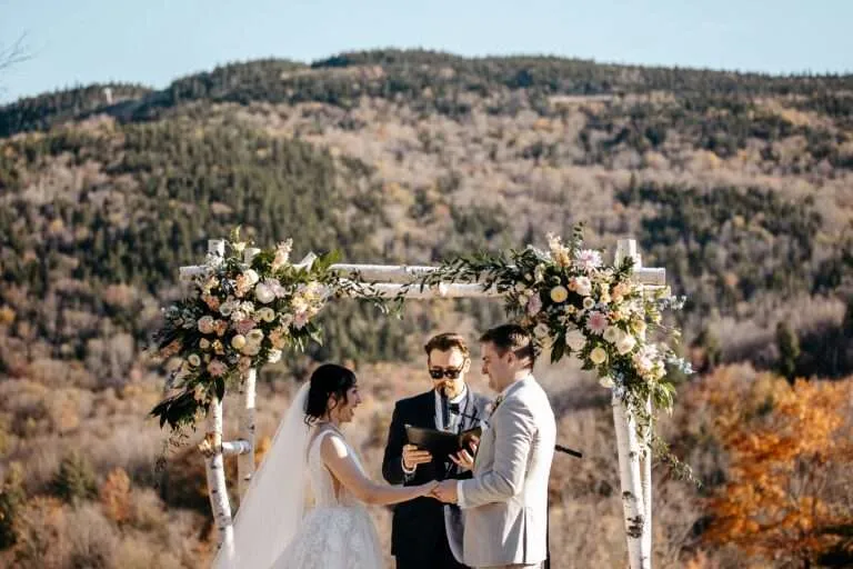 couple at the altar saying their vows