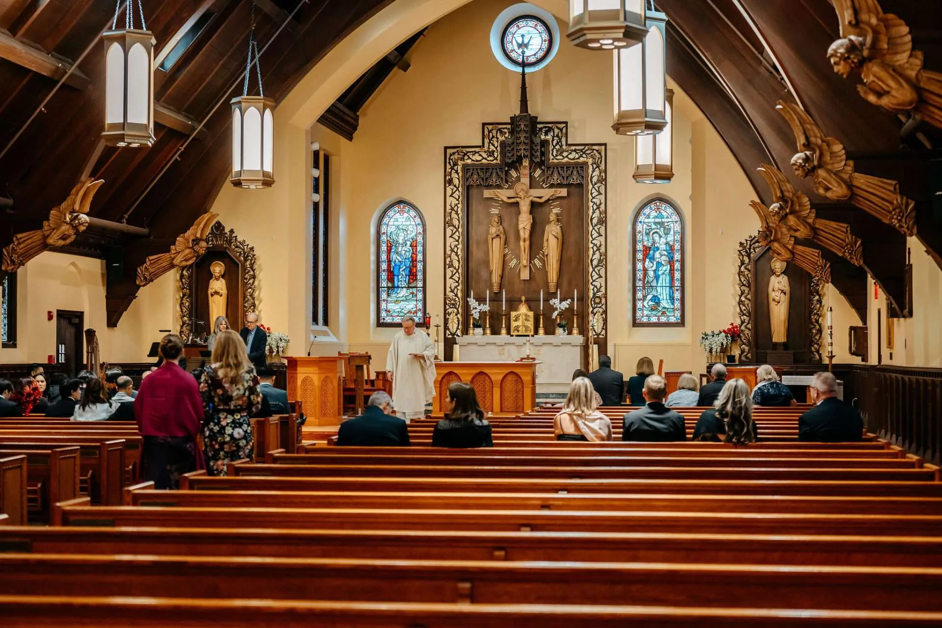 Wedding guests file into pews preparing for a ceremony at small wedding venues in boston