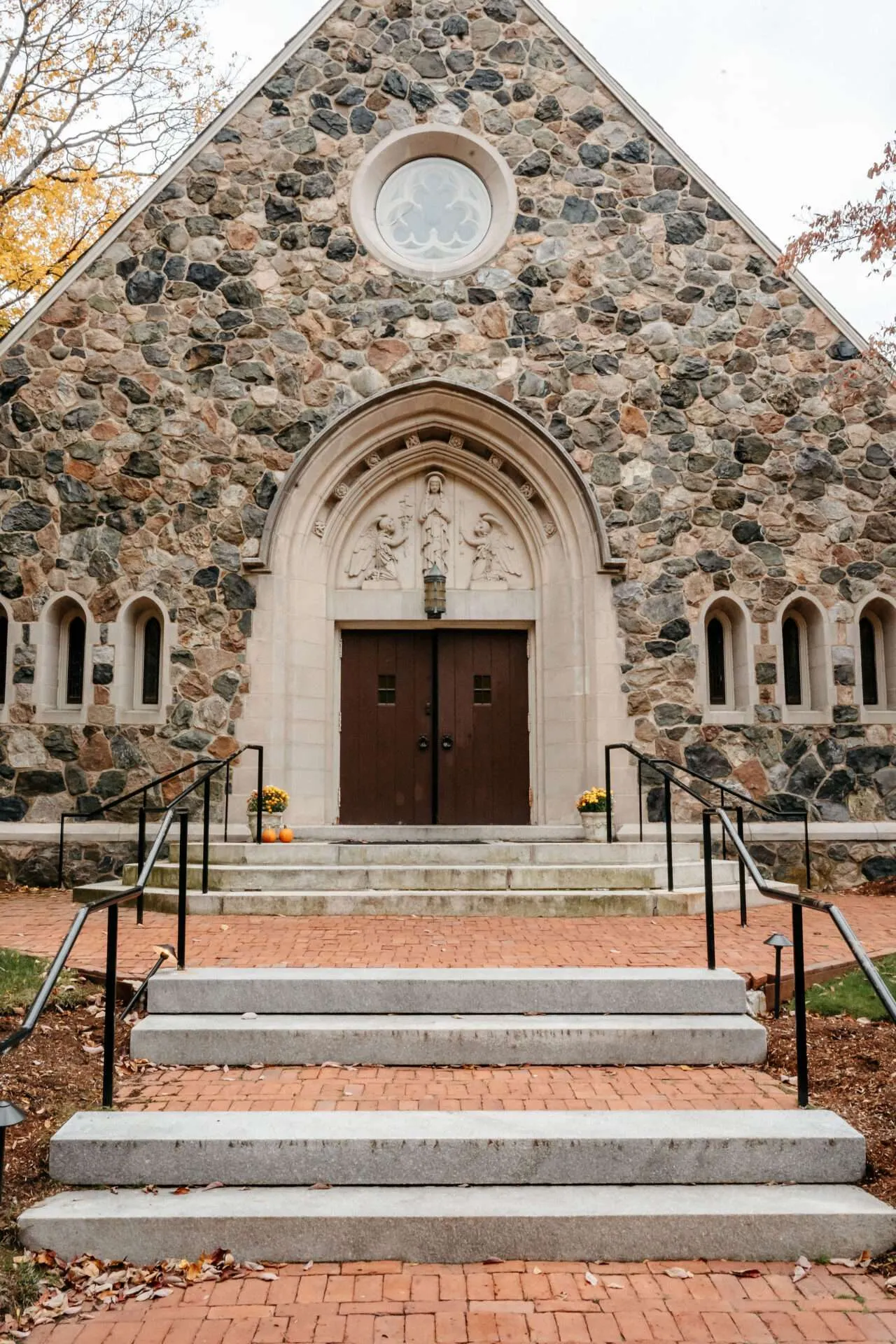 A church with a stone wall is one of many small wedding venues massachusetts in massachusetts