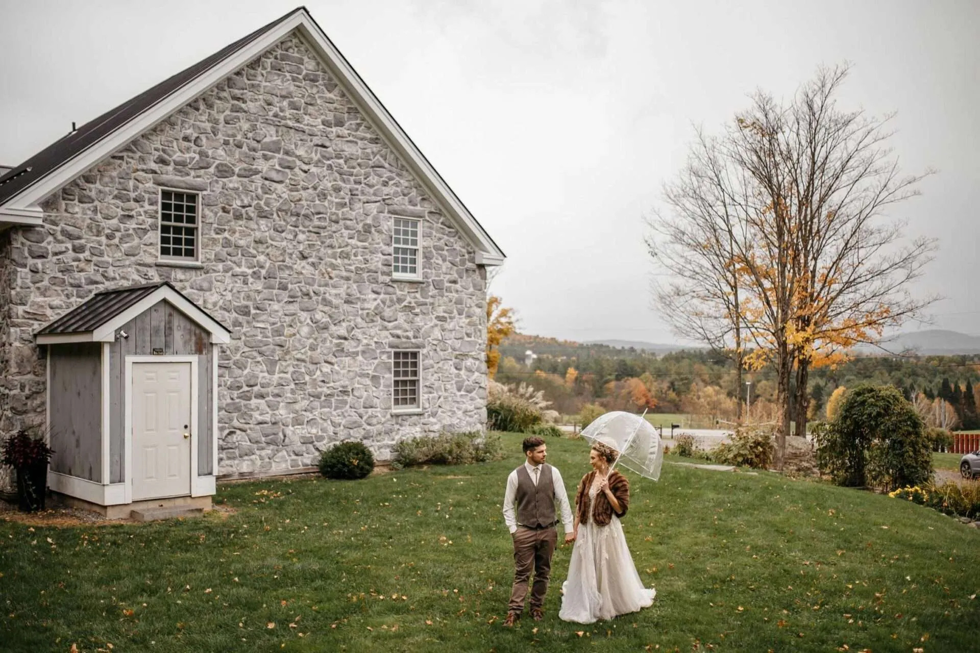 couple walking outside in Boston on rainy wedding day