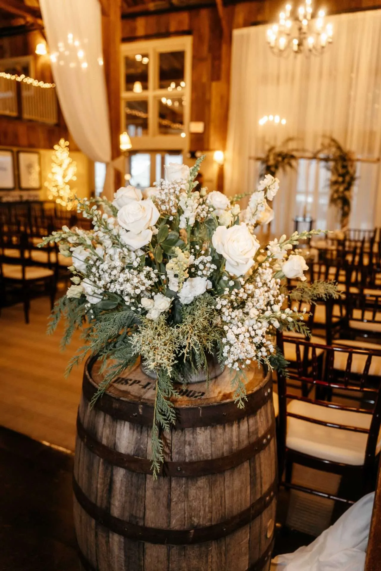 flower bouquet on barrel at wedding planned by wedding planner in Boston