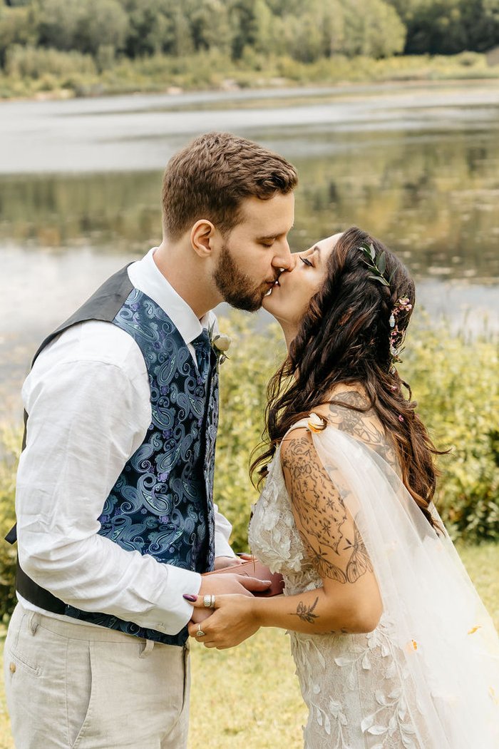 Bride and groom kissing beside a pond – Page & Logan