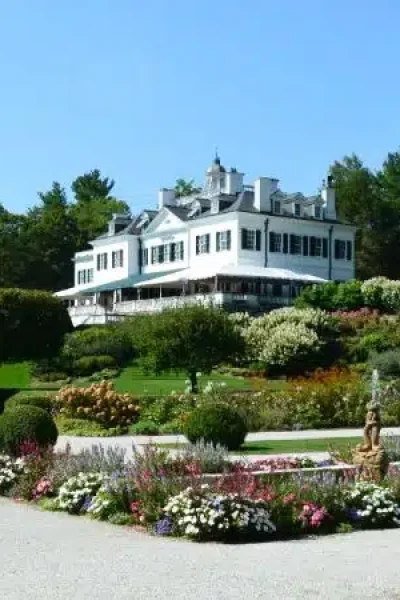 The historic white mansion and manicured gardens of The Mount, Edith Wharton's Home, in Lenox, Massachusetts.